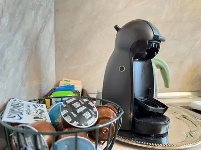 a coffee maker sitting on top of a table at Aristocratic Top Central Apartment in Sofia