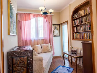 a living room with a couch and a window at Aristocratic Top Central Apartment in Sofia