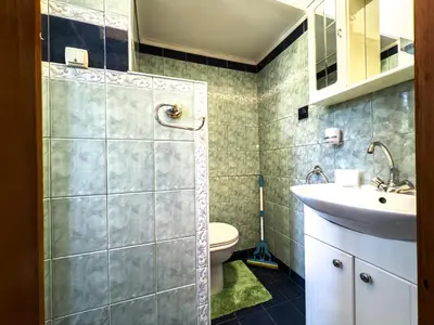 a bathroom with a sink and a toilet at Aristocratic Top Central Apartment in Sofia