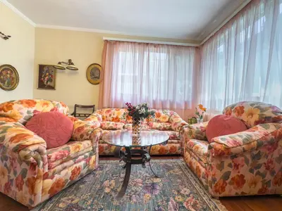 a living room with two couches and a table at Aristocratic Top Central Apartment in Sofia