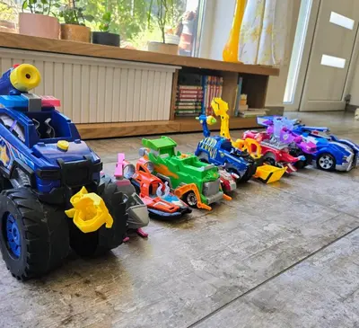 a group of toy cars and trucks on the floor at Ma-Bebe PlayHouse with Private Sauna --- Lake, Parks and SPA Pools in 5 min in Pancharevo