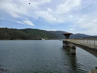a bridge over a large body of water at Ma-Bebe PlayHouse with Private Sauna --- Lake, Parks and SPA Pools in 5 min in Pancharevo
