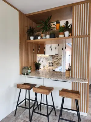 a kitchen with two stools and a counter with plants at Ma-Bebe PlayHouse with Private Sauna --- Lake, Parks and SPA Pools in 5 min in Pancharevo