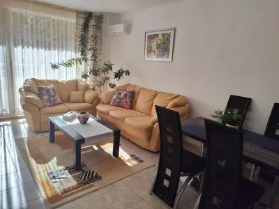 a living room with a couch and a table at Guest House Amaya Riva in Plovdiv