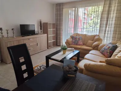 a living room with a couch and a table at Guest House Amaya Riva in Plovdiv