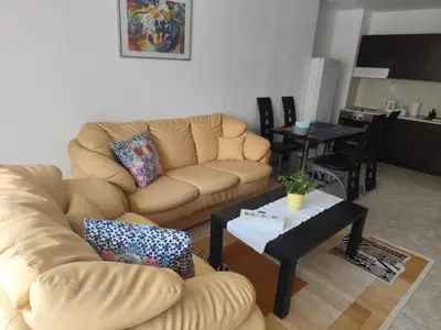 a living room with a couch and a table at Guest House Amaya Riva in Plovdiv