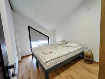 a bedroom with a bed in a room at White Peak 2rooms ap in Bansko