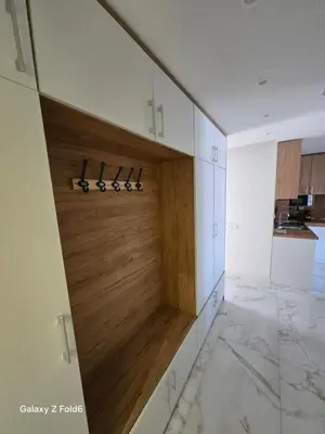 a kitchen with a cabinet with a wooden door at Dilyanka 3 in Pernik
