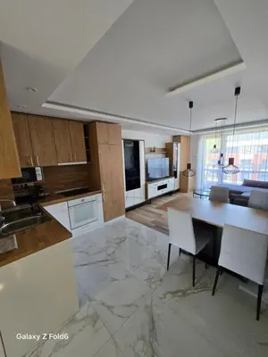 a large kitchen with a large marble floor at Dilyanka 3 in Pernik