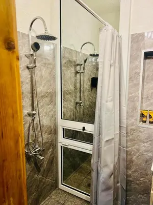 a shower with a glass door in a bathroom at Boby Center Home in Sofia