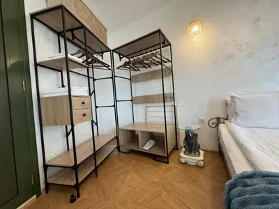 a room with two bunk beds and a bed at Just a Dream - guest apartments in Troyan
