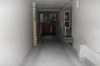 an empty hallway of a building with a stairway at Комфортен апартамент, безплатно гараж! in Sofia