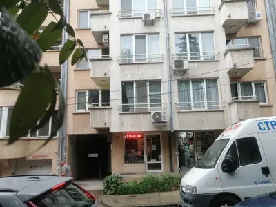 a white van parked in front of a building at Комфортен апартамент, безплатно гараж! in Sofia