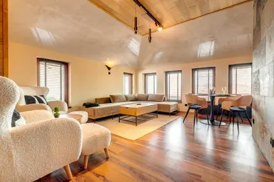 a living room with a couch and a table at Luxury 1BD Retreat in Grand Resort Pamporovo by Flat Manаger in Pamporovo