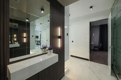 a bathroom with a sink and a mirror at Home Lux in Gotse Delchev