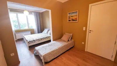a bedroom with a bed and a mirror in it at No X - Sofia top center in Sofia