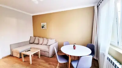 a living room with a couch and a table at No X - Sofia top center in Sofia