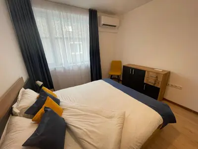a bedroom with a large bed and a window at Sofia City Quiet Retreat in Sofia