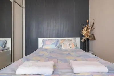 a bedroom with a large bed with pillows at Modern Apartment - Top Location - Friendly Host by Flat Manager in Sofia