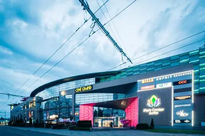 a large building with a sign on the front of it at D-home in Sofia