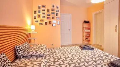 a bedroom with a large bed with a wooden headboard at City Nest 1BD in Lozenets by Flat Mаnager in Sofia