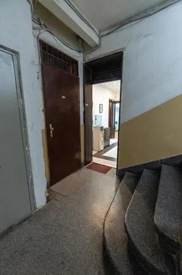 an empty room with a door and a hallway at Sofique 3BR in Sofia