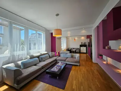 a living room with a couch and a table at Simply The Best - Vitosha blvd in Sofia