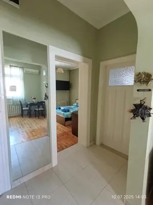 a living room with a view of a bedroom at Vinchenco and G Suites in Sofia