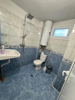 a bathroom with a toilet and a sink at DJOKI Apartment in Sandanski