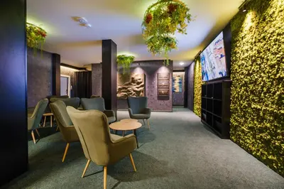 a waiting room with chairs and a tv at А17 Plovdiv Apartments - Next to Rowing Channel and University hospitals in Plovdiv