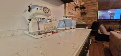 a kitchen counter with a mixer on top of it at Boutique Apartment Katerina in Bansko