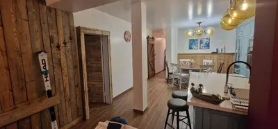 a room with a kitchen and a dining room at Boutique Apartment Katerina in Bansko