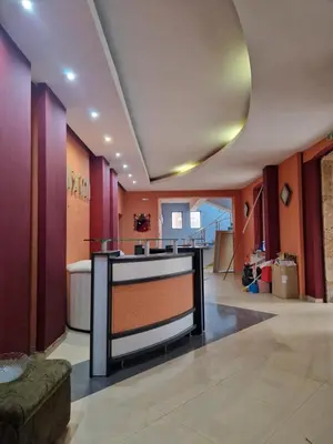 a lobby with a reception desk in a building at Семеен хотел МАКСИМ in Teteven