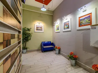 a hallway with a blue chair in a room at Winter Palace Vitosha View Studio in Sofia