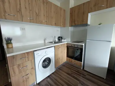 a kitchen with a washer and a dishwasher at Ishirkov Residence Studio 2 in Sofia