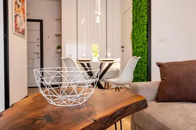 a living room with a table and a couch at Elena apartment in Sandanski
