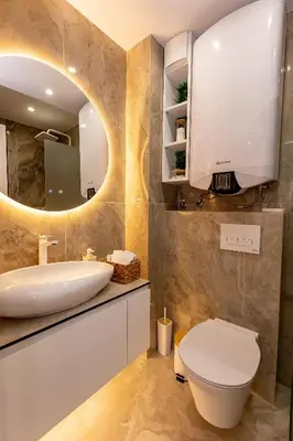 a bathroom with a sink and a mirror at Elena apartment in Sandanski