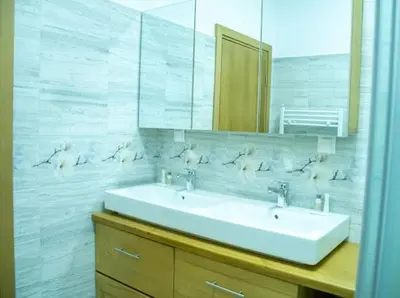 a bathroom with a sink and a mirror at Villa Stemara in Razlog