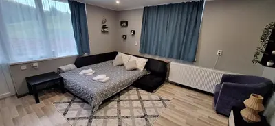 a living room with a couch and a table at Stoykite view in Stoykite