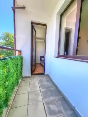 a corridor of a house with a door and a window at Nevena 206 B&P in Bansko