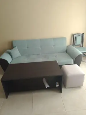 a living room with a couch and a coffee table at Nova lofts in Sofia