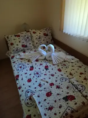 two swans shaped like hearts are sitting on a bed at Villa Bulgarka in Divchovoto