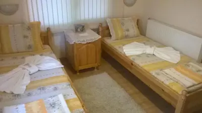 two twin beds in a room with at Villa Bulgarka in Divchovoto