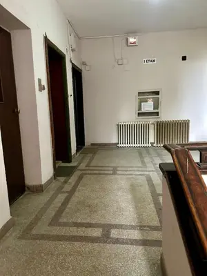 a hallway of an empty room with a radiator at Apartment top center Maria in Sofia