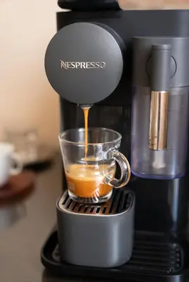 a coffee maker is making a cup of coffee at Paradise Nest in Sofia