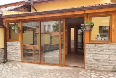an entrance to a house with sliding glass doors at Guest house Dinaya-2 in Dobrinishte