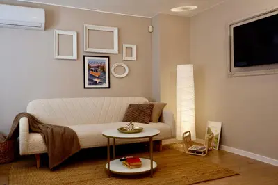 a living room with a couch and a table at Hidden Courtyard Gem - House in Sofia Center in Sofia