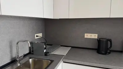 a kitchen with a sink and a counter top at Modern and cozy apartment in the city centre in Sofia