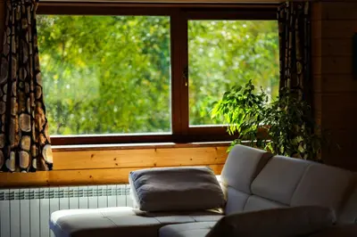 a living room with a couch and a window at Abies Alba in Yarema residence zone