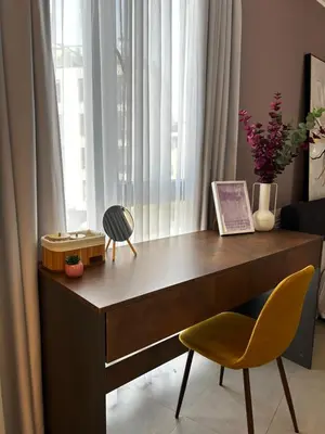 a wooden desk with a chair and a window at Rea Liliya - Artistic and Inviting Nook in Sofia